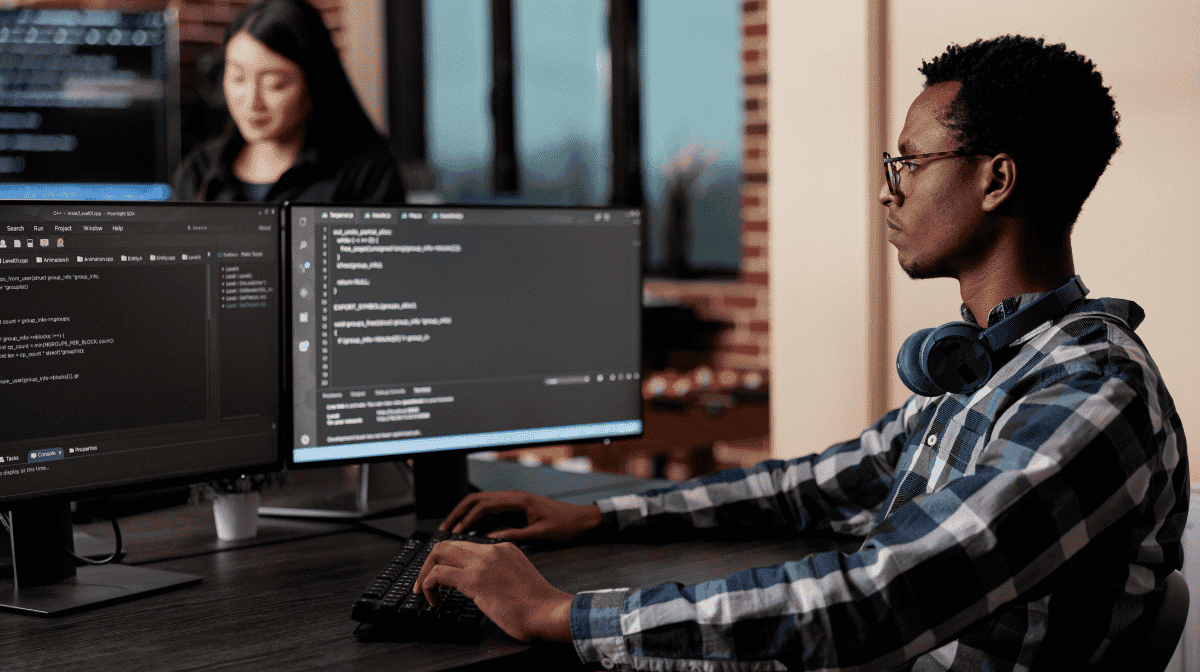 Image of a man at a computer, used on the blog post about container hardening